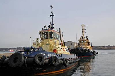 Two red and white tugboats
